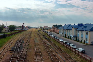 Fototapeta na wymiar Railroad tracks near the station building of Lida sity