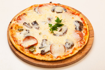 pizza on wooden cutting board