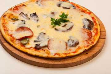 pizza on wooden cutting board