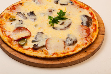 pizza on wooden cutting board