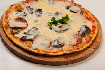 pizza on wooden cutting board