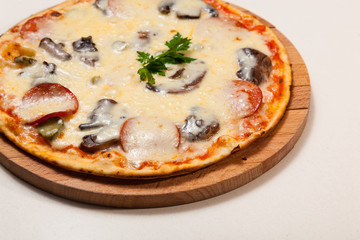 pizza on wooden cutting board