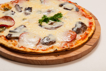 pizza on wooden cutting board