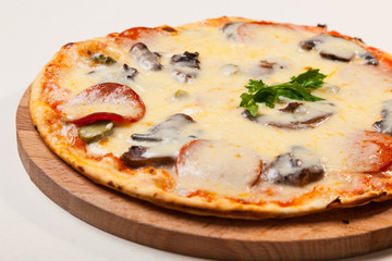 pizza on wooden cutting board