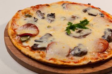 pizza on wooden cutting board