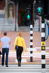 Couple crossing the pedestrian crossing