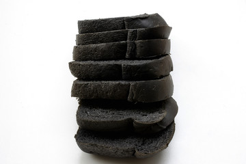Fototapeta na wymiar Organic homemade charcoal bread on white background. 