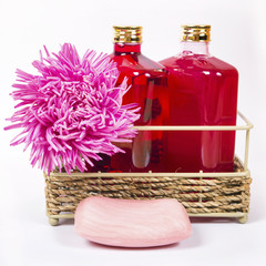 Bath salt, soap and shampoo in pink and violet color with flowers