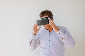 Happy businessman watches content on a virtual reality display