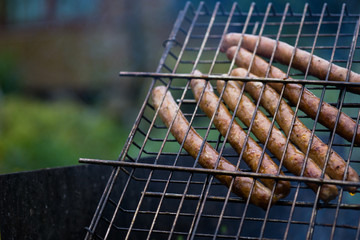 Frankfurt long thin sausages on the grill