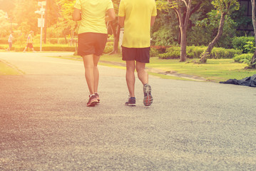 People jogging outdoor in the park, morning and evening