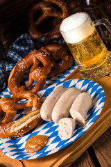 Bavarian sausage with pretzel, sweet mustard and beer