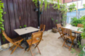 blur background .Outdoor coffee shop with tables and chairs