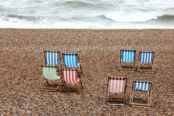 Deck Chairs looking out to sea on Brighton beach