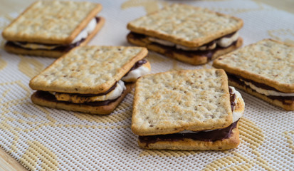 Homemade smores placed on tablecloth