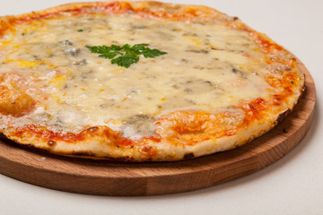 pizza on wooden cutting board