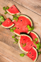 Watermelon juice, watermelon slices and mint leaves. Dessert. Fl