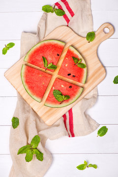 Watermelon juice, watermelon slices and mint leaves. Dessert. Fl