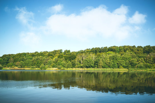 Idyllic lake landscape with trees