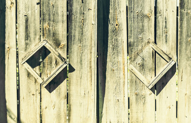 Grey old fence sunny day