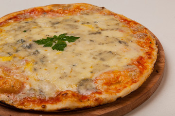pizza on wooden cutting board