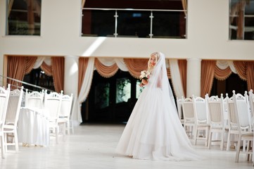 Elegant blonde blue eyes fashion bride at great wedding hall