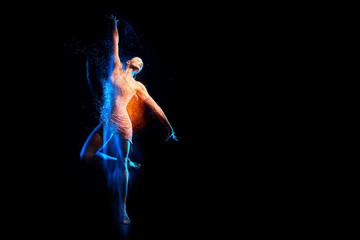 Fine art portrait of beautiful woman dancer in blue sparkles