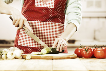 woman with knife and kitchen room 