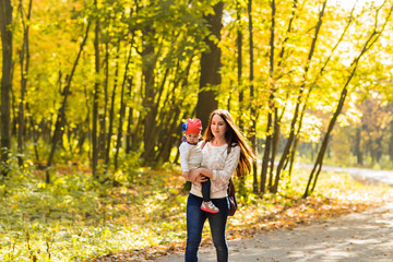 Mother and daughter in the autumn park