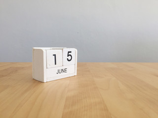 June 15th.June 15 white wooden calendar on vintage wood abstract