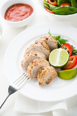 Pork with vegetables and lime on the white.
