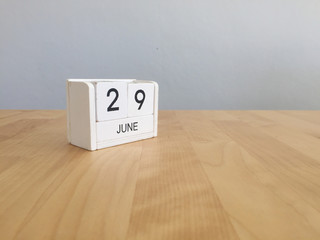 June 29th.June 29 white wooden calendar on vintage wood abstract