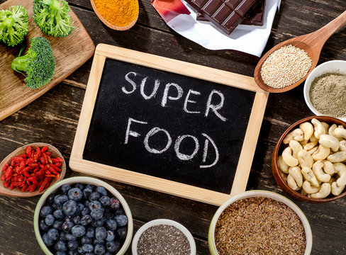 Super foods on a rustic wooden background.