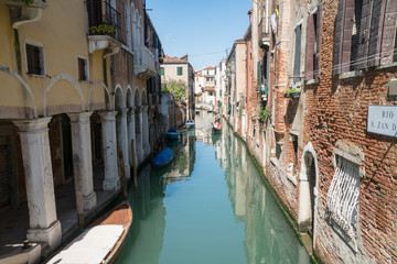Fototapeta na wymiar A backwater canal in Venice, Italy