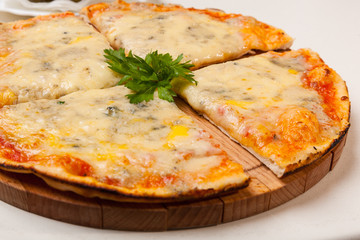 pizza on wooden cutting board