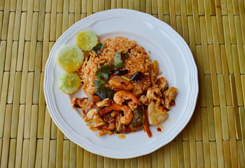 spicy fried rice with seafood and herb on dish