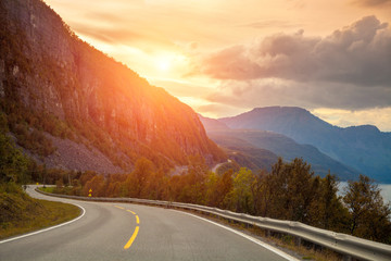Naklejka premium Mountain road at sunset