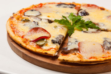 pizza on wooden cutting board