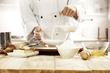 cook in kitchen interior 