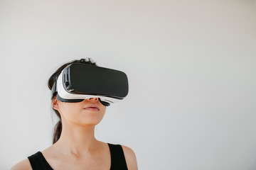 Young woman wearing VR goggles