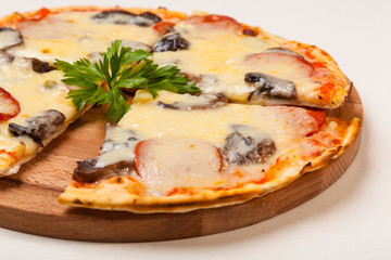 pizza on wooden cutting board