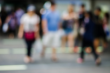 people in motion blur at the skytrain station