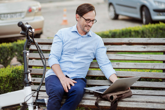 Good looking man working on laptop.