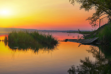 Beautiful sunset over calm lake. Dusk time
