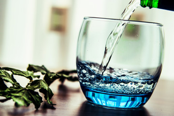 Pouring Mineral Water into the Glass.