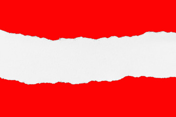 Torn Piece of White Paper on Red background