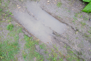 fragment of a broken village roads after rain