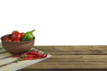 Vegetables on wooden background on white