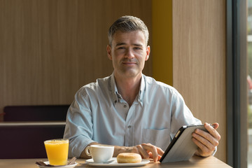 Businessman having breakfast