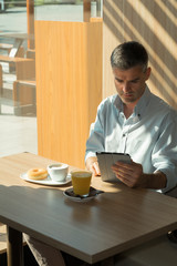 Businessman relaxing at the cafe